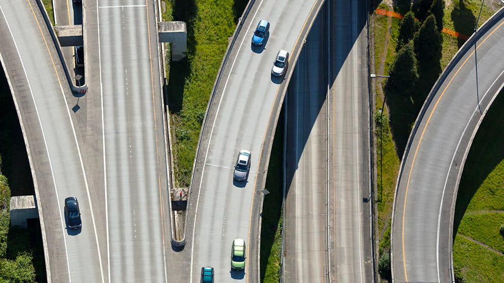 Aerial shot of road junction and cars