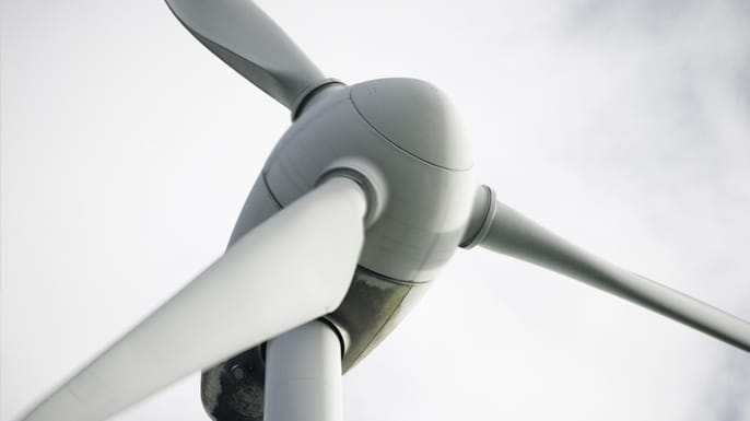 wind turbine with blue gray sky
