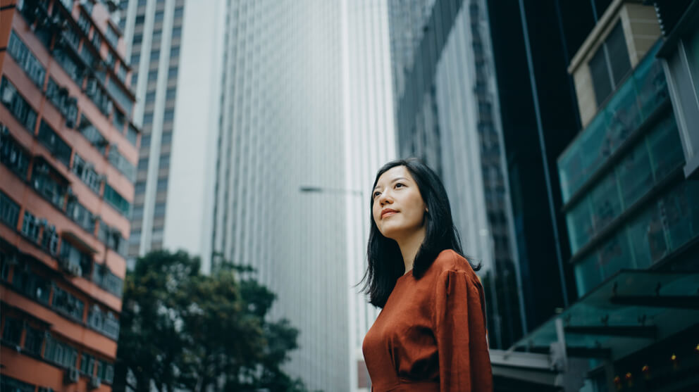 woman in front of skyscrapers