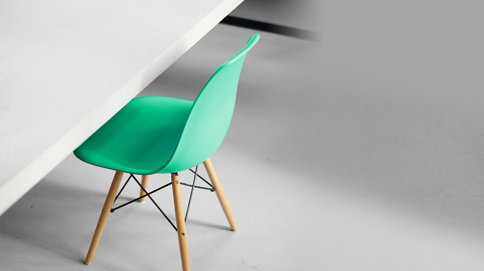 green chair under white desk