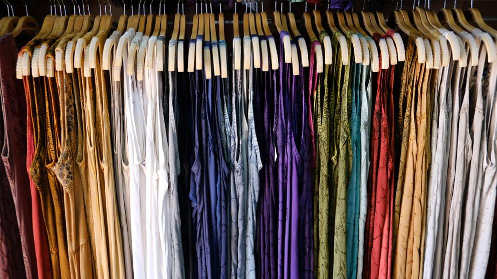 Multi-coloured dresses on hangers