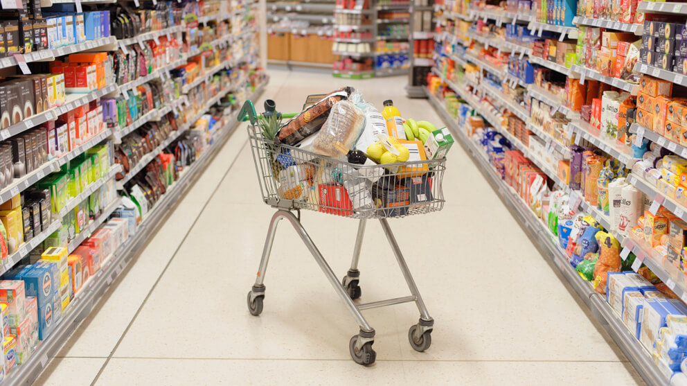 Full shopping cart in aisle