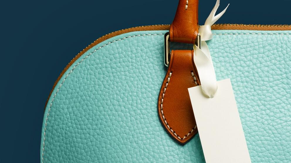 Blank Tag on Turquoise Handbag Close-Up