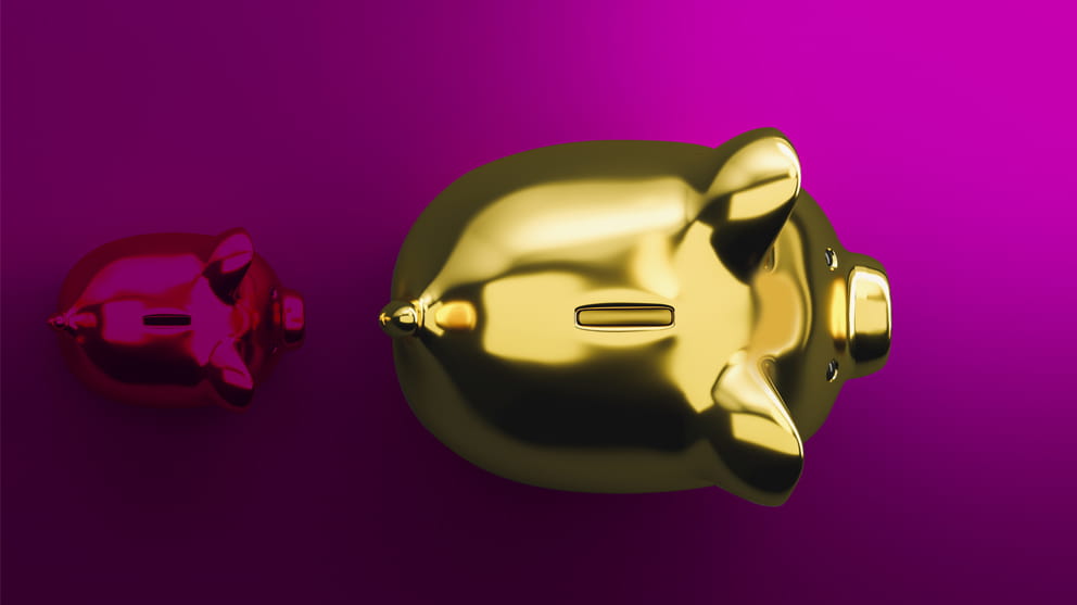 Piggy banks on pink background