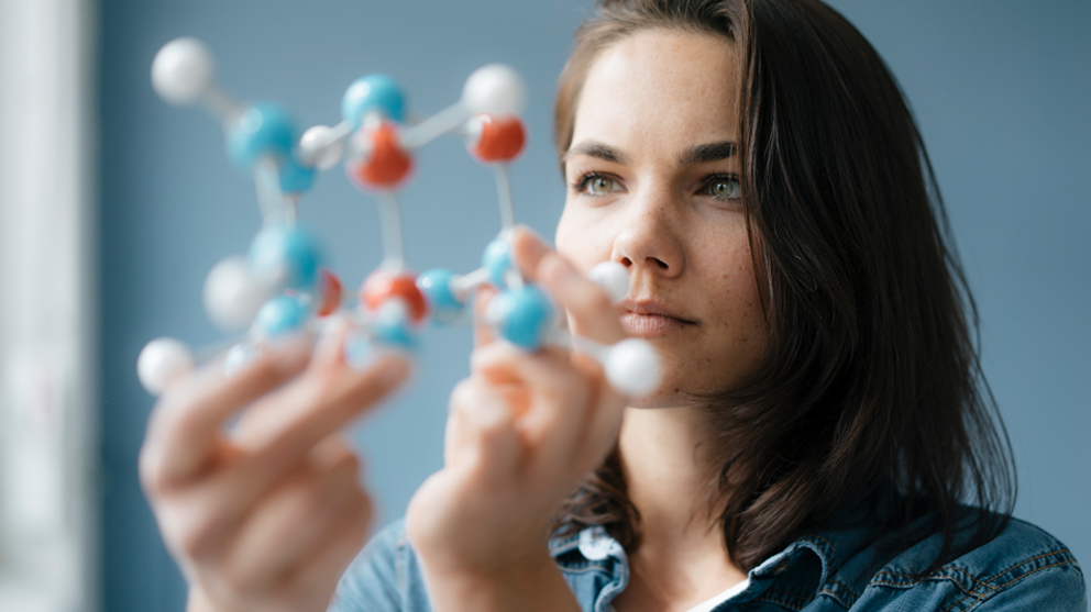 scientist-with-molecule-models