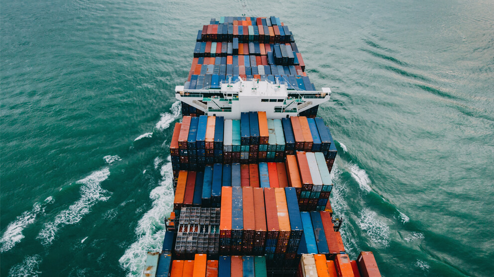 Top view of container ship transporting goods