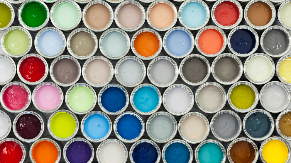 View from above of different coloured paint pots