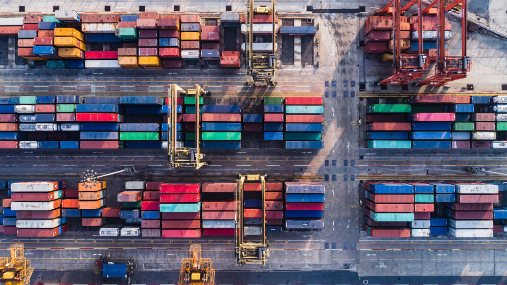 Aerial view of stacks of cargo containers and loading equipment