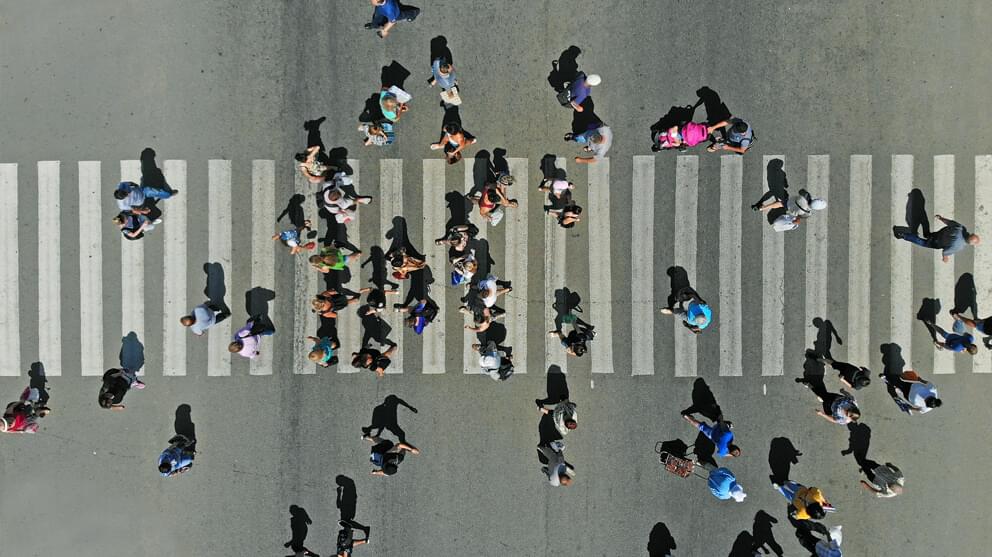 Top view of people crowd on pedestrian crosswalk