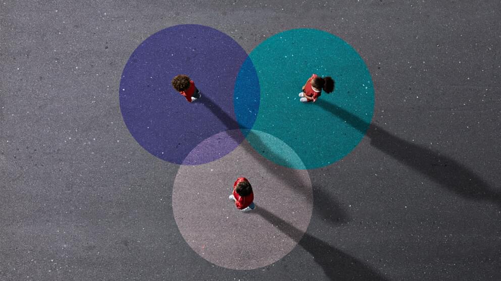 View from above of people standing on painted Venn Diagrams