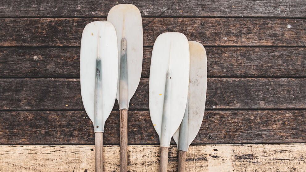 Close-Up Of Paddle on wooden background