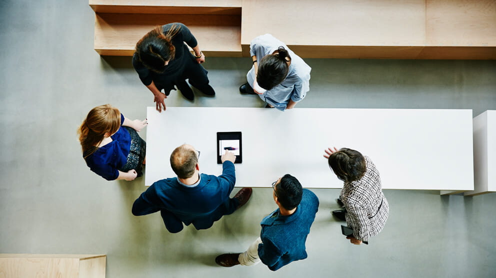 View from above of colleagues discussing project