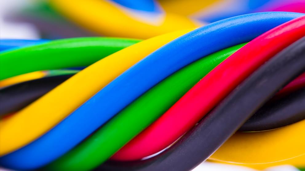 Rainbow coloured electric cable close-up