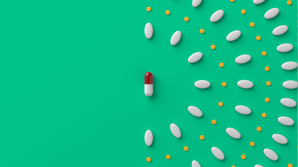 Patterned pills on green background