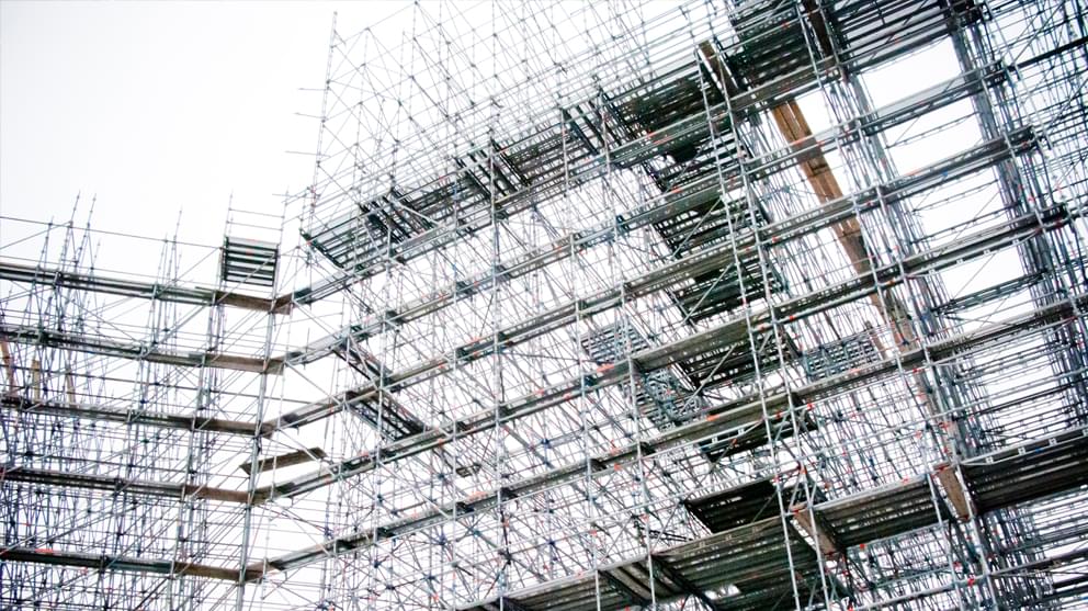 Building with scaffolding at construction site