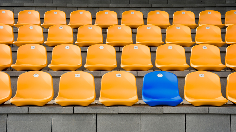 blue seat in middle of yellow seats