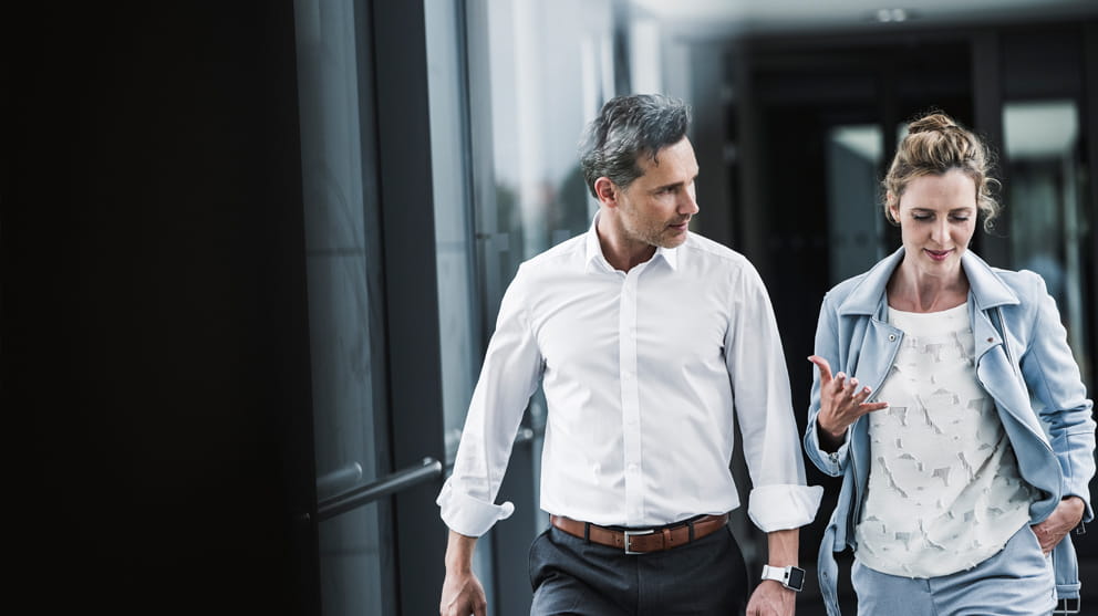 Business people talking in passageway
